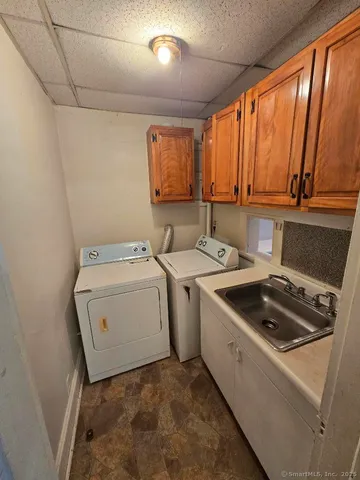 a utility room with dryer and washer