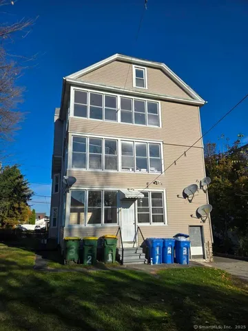 a front view of building with yard