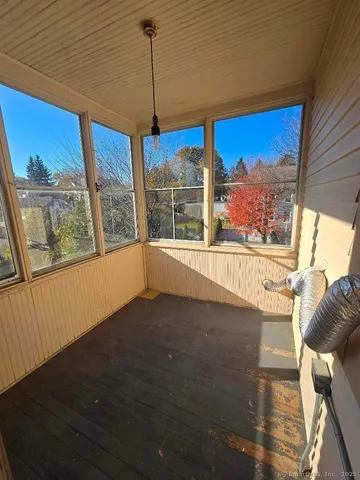 a view of a room with a large window