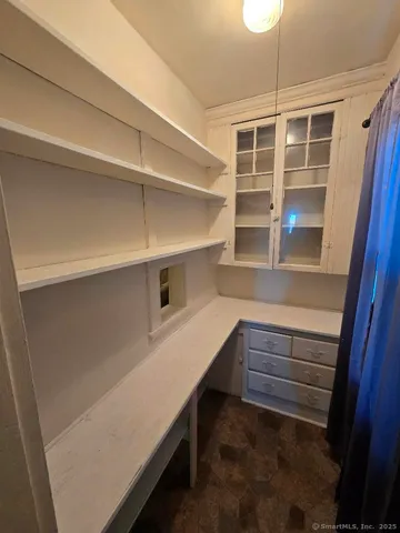 a storage room with a wooden floor