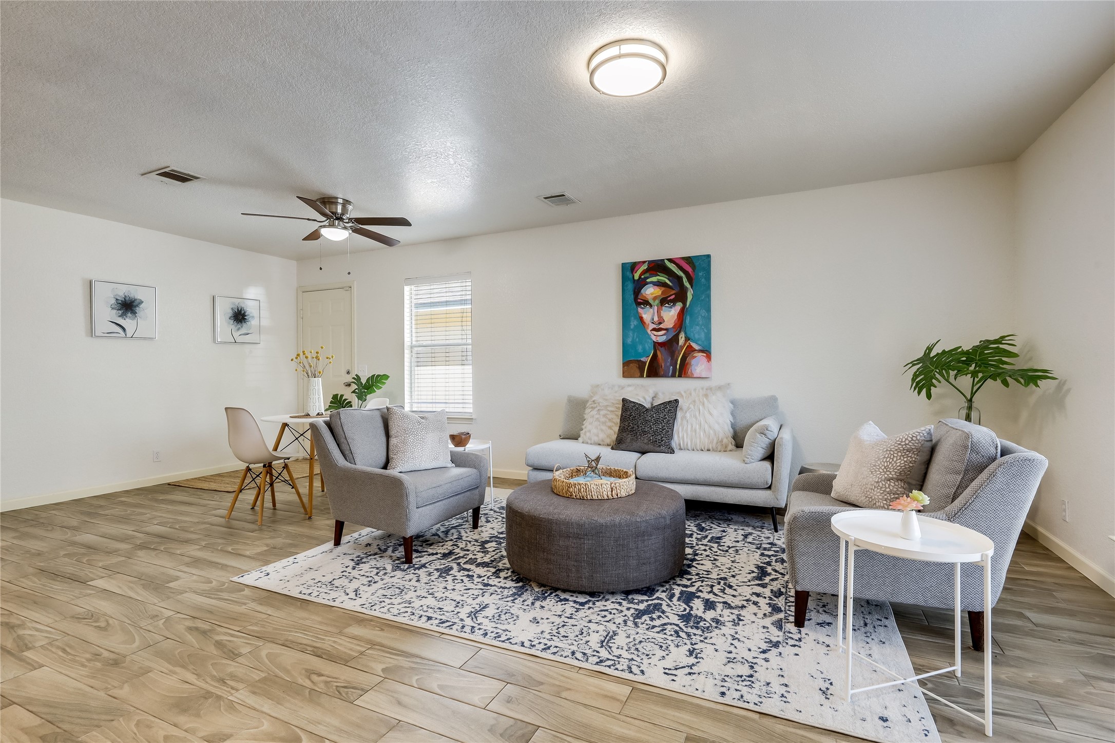 4510 Secure Lane Austin, TX 78725 - Photo 6 of 24 a living room with furniture and a wooden floor