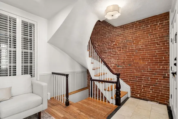 a view of entryway with wooden floor