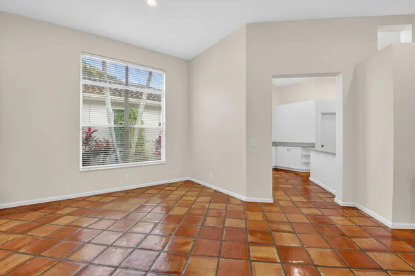 a view of a hallway with front door and bedroom
