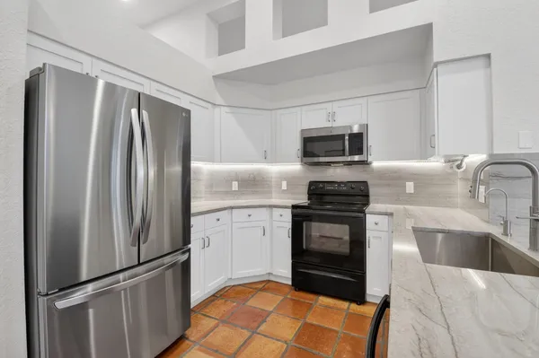 a kitchen with a sink and a window