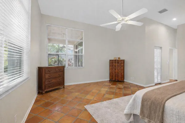 a room with chair and a window