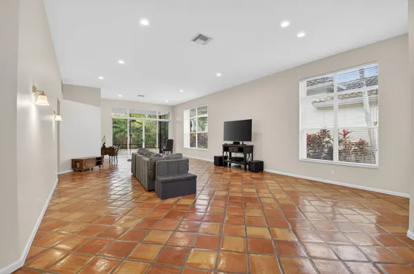 a view of a livingroom with furniture and a flat screen tv