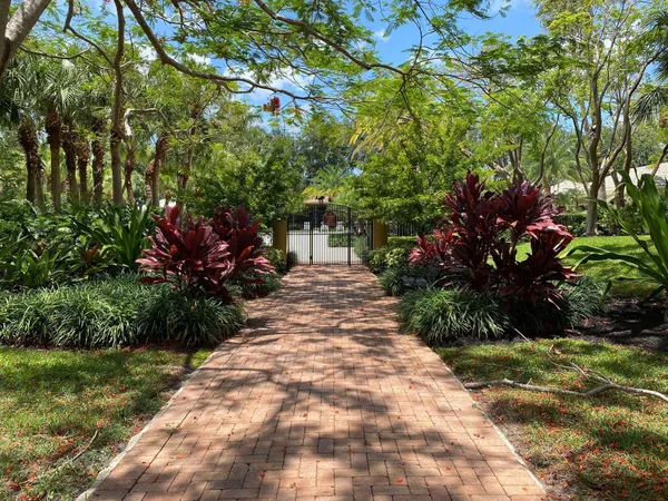 a view of a swimming pool and a yard