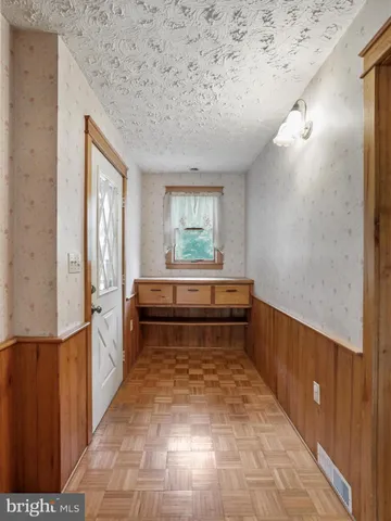 a bathroom with a bathtub and a window