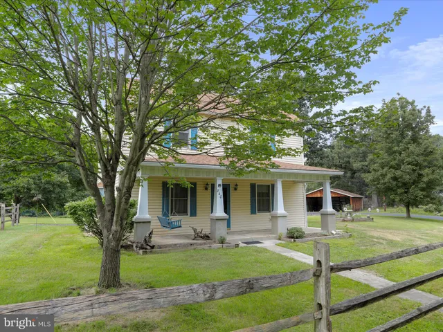 a front view of house with yard patio and green space