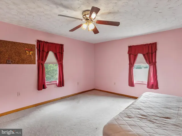 a view of entryway and hall with a window