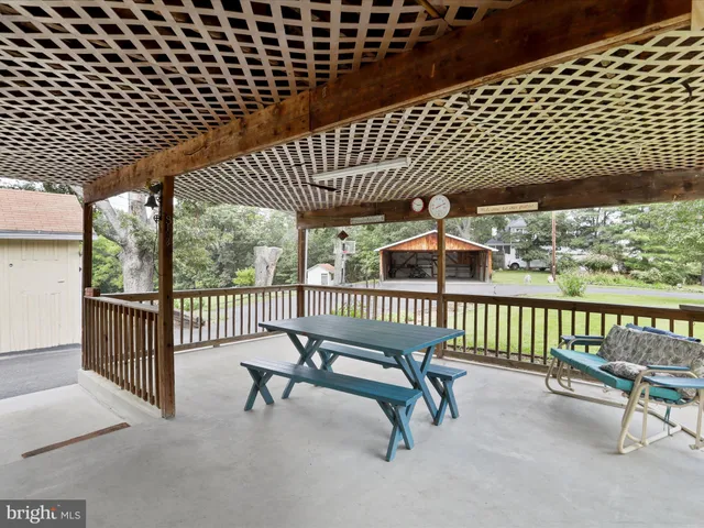 a view of a roof deck with wooden fence