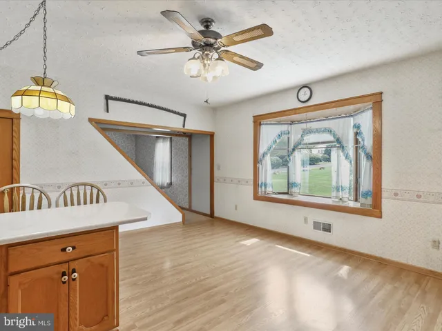 a view of an entryway with wooden floor