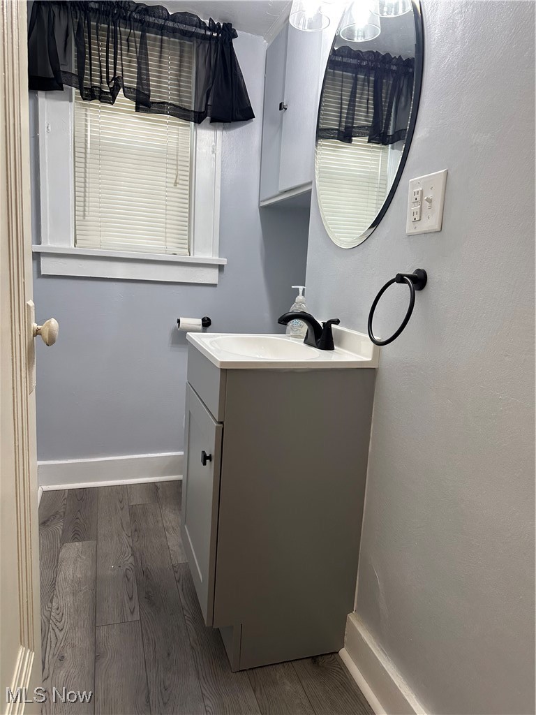 7954 Warren - Sharon Road Masury, OH 44438 - Photo 13 of 28 Half bathroom featuring dark wood-style floors and vanity