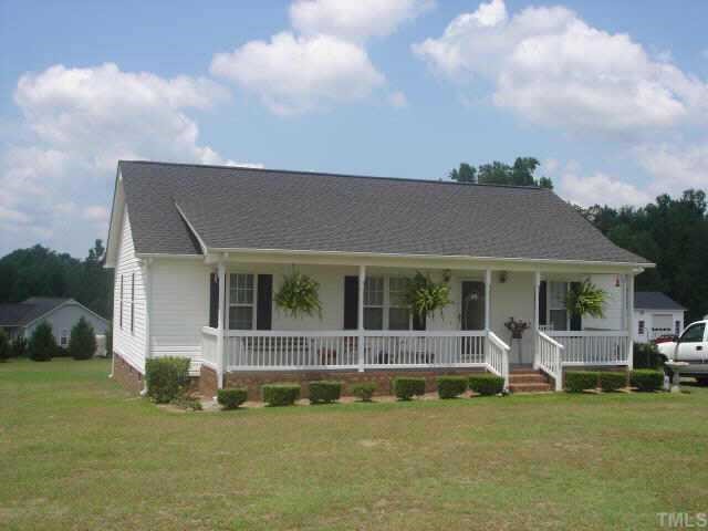 1025 Live Oak Road Coats, NC 27521 - Photo 2 of 6 a view of a house with backyard porch and sitting area