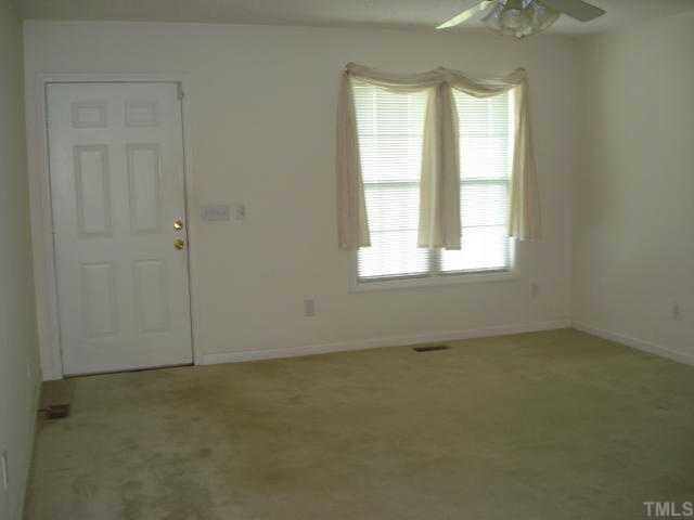 1025 Live Oak Road Coats, NC 27521 - Photo 3 of 6 an empty room with a window