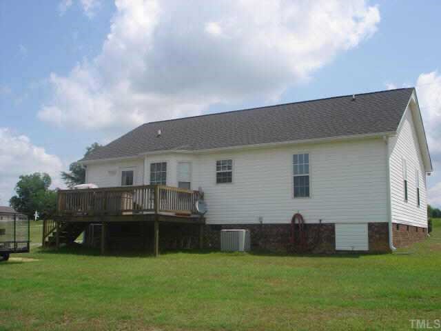 1025 Live Oak Road Coats, NC 27521 - Photo 5 of 6 a view of a house with a backyard