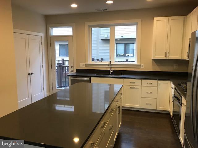 16316 Decker Place Rockville, MD 20855 - Photo 14 of 27 a kitchen with counter top space and windows