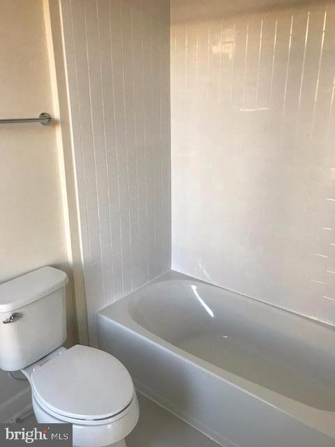 16316 Decker Place Rockville, MD 20855 - Photo 21 of 27 a white toilet sitting next to a bath tub