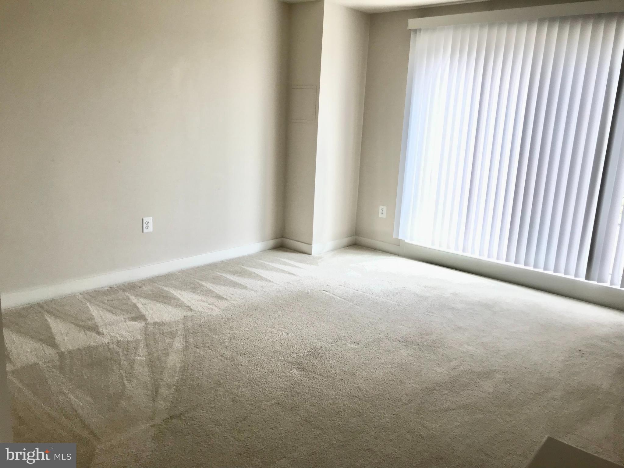 16316 Decker Place Rockville, MD 20855 - Photo 24 of 27 a view of a livingroom with an empty space and a window