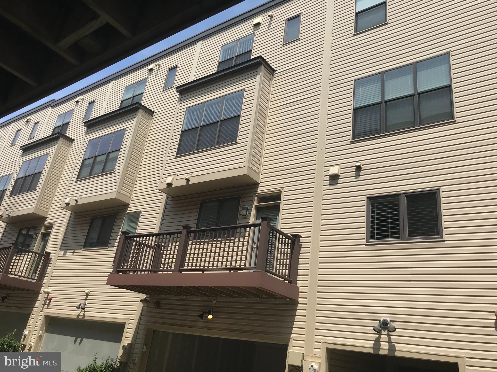 16316 Decker Place Rockville, MD 20855 - Photo 3 of 27 a view of a house with large windows