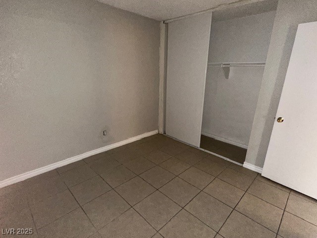 3106 Cummings Street North Las Vegas, NV 89030 - Photo 7 of 12 Unfurnished bedroom featuring a closet and tile patterned floors