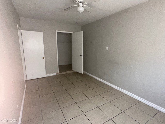 3106 Cummings Street North Las Vegas, NV 89030 - Photo 10 of 12 Unfurnished bedroom featuring a closet, light tile patterned floors, and ceiling fan