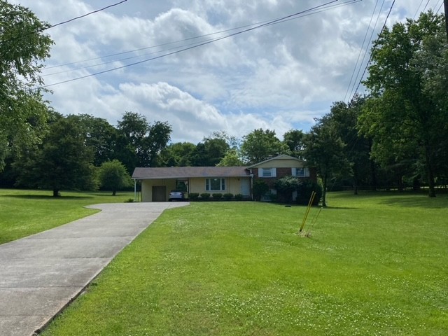 580 Vanderbilt Road Mount Juliet, TN 37122 - Photo 1 of 27 a backyard of a house with lots of green space