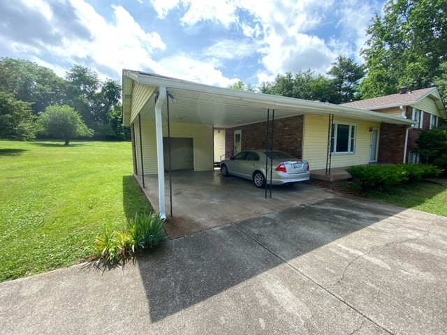 580 Vanderbilt Road Mount Juliet, TN 37122 - Photo 3 of 27 a car parked in front of house