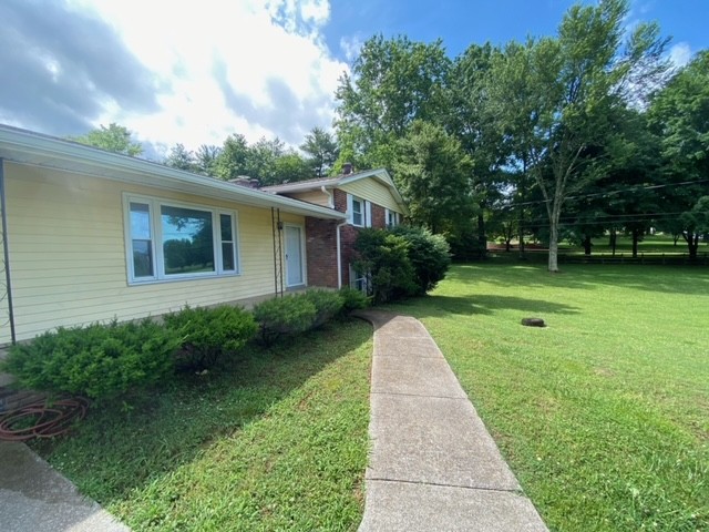 580 Vanderbilt Road Mount Juliet, TN 37122 - Photo 4 of 27 a view of a backyard with plants and large trees