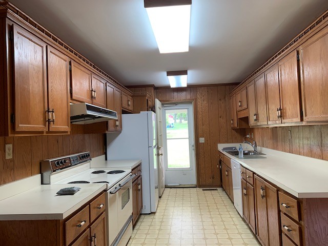 580 Vanderbilt Road Mount Juliet, TN 37122 - Photo 8 of 27 a kitchen with stainless steel appliances granite countertop a stove a refrigerator a sink dishwasher and wooden cabinets with wooden floor