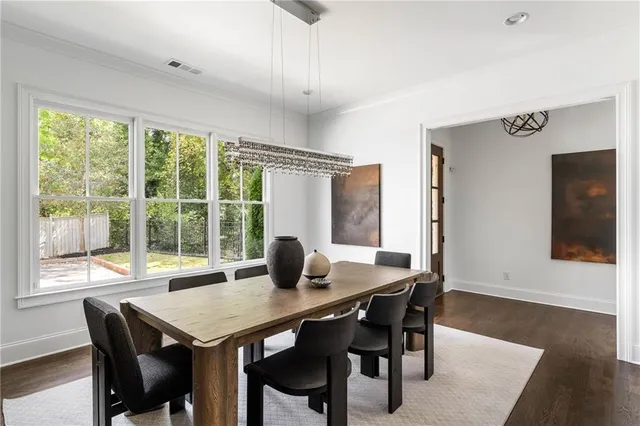 a view of a dining room with furniture window and wooden floor