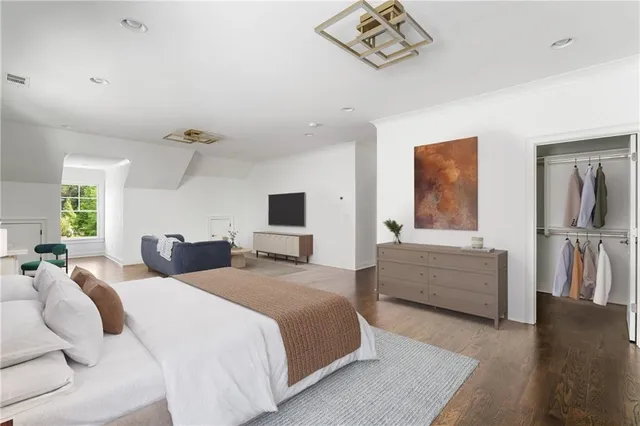 a bedroom with two beds and a couch