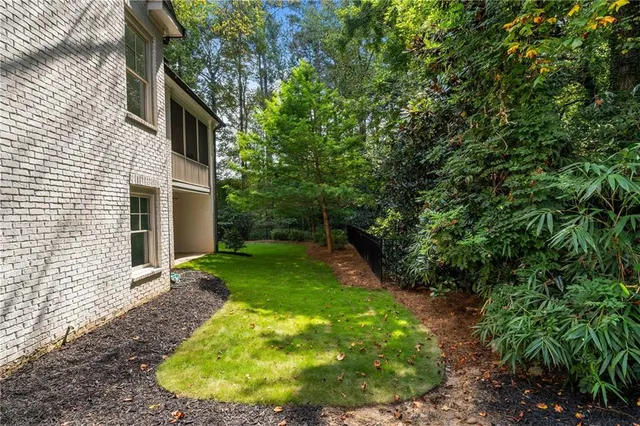 a backyard of a house with lots of green space