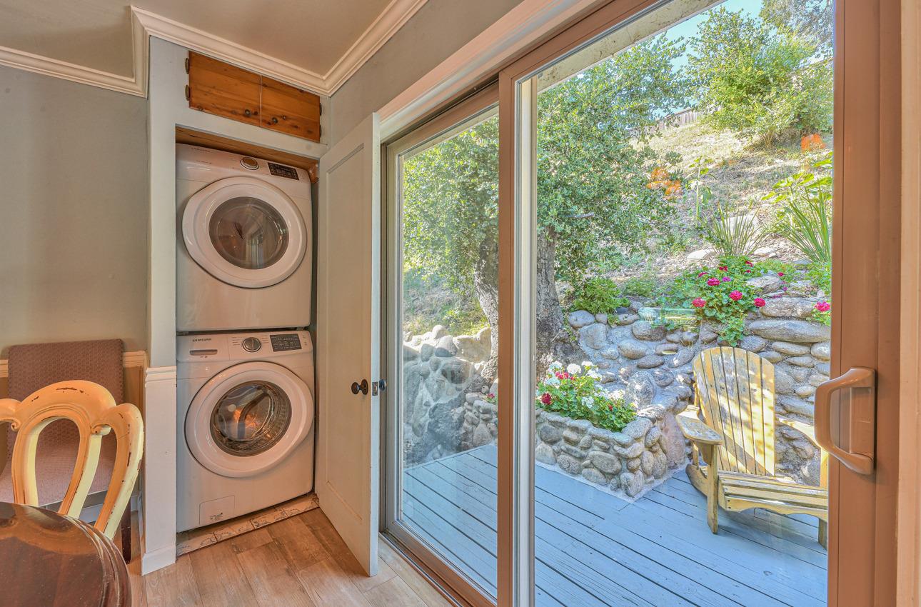 7 Paso Cresta Carmel Valley, CA 93924 - Photo 13 of 44 a view of a bedroom with washer and dryer