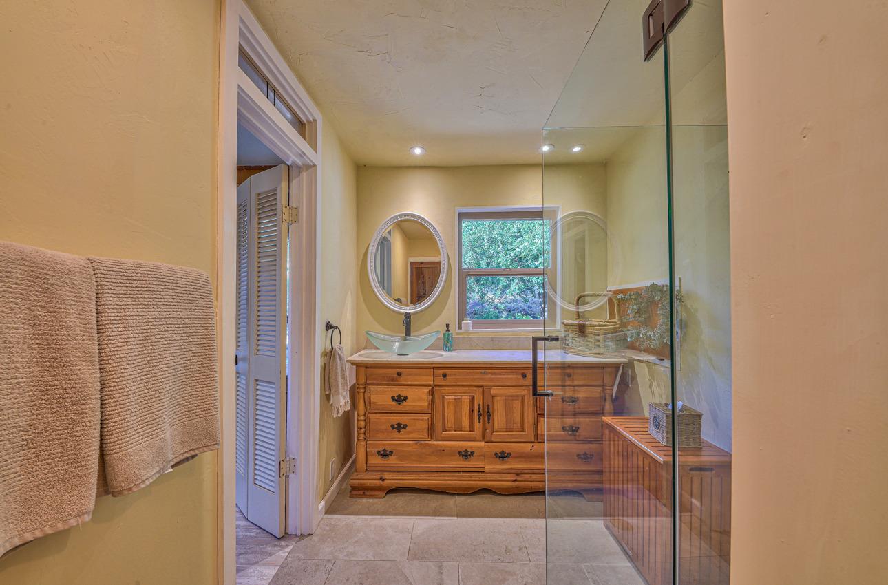 7 Paso Cresta Carmel Valley, CA 93924 - Photo 21 of 44 a view of a hallway with washer and dryer