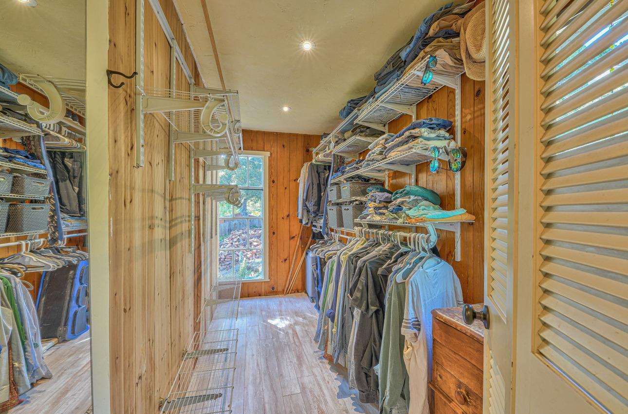 7 Paso Cresta Carmel Valley, CA 93924 - Photo 23 of 44 a view of walk in closet with clothes and shoes