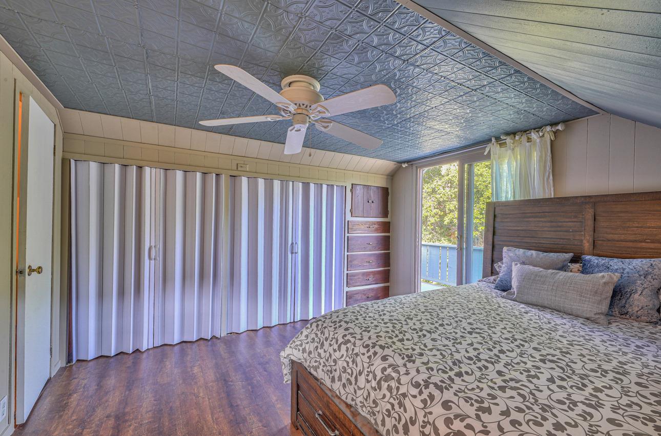 7 Paso Cresta Carmel Valley, CA 93924 - Photo 27 of 44 a bedroom with a bed and a dresser