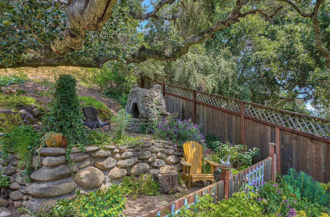 7 Paso Cresta Carmel Valley, CA 93924 - Photo 35 of 44 a garden with plants and wooden fence