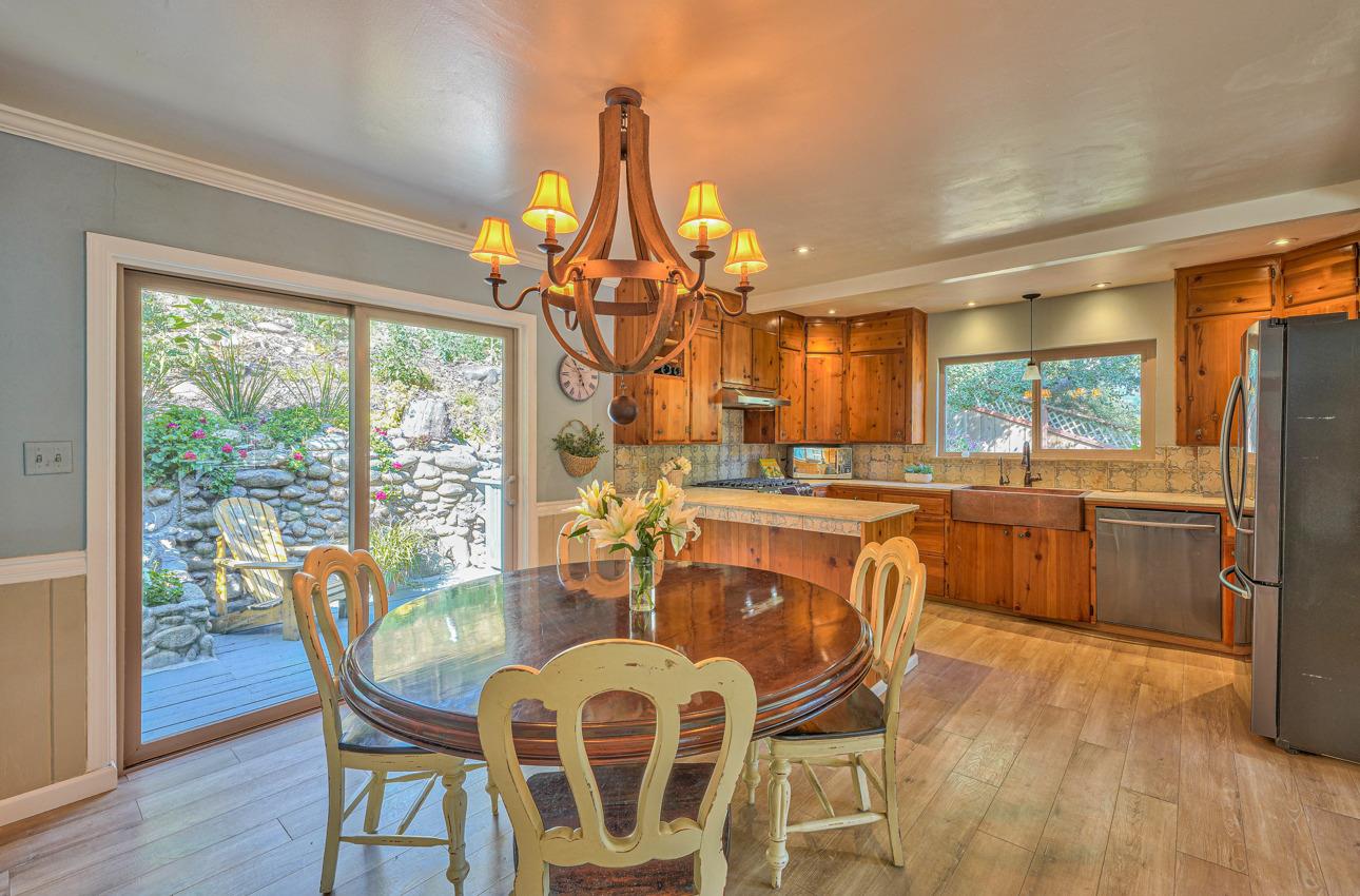 7 Paso Cresta Carmel Valley, CA 93924 - Photo 4 of 44 a dining room with furniture a chandelier and wooden floor