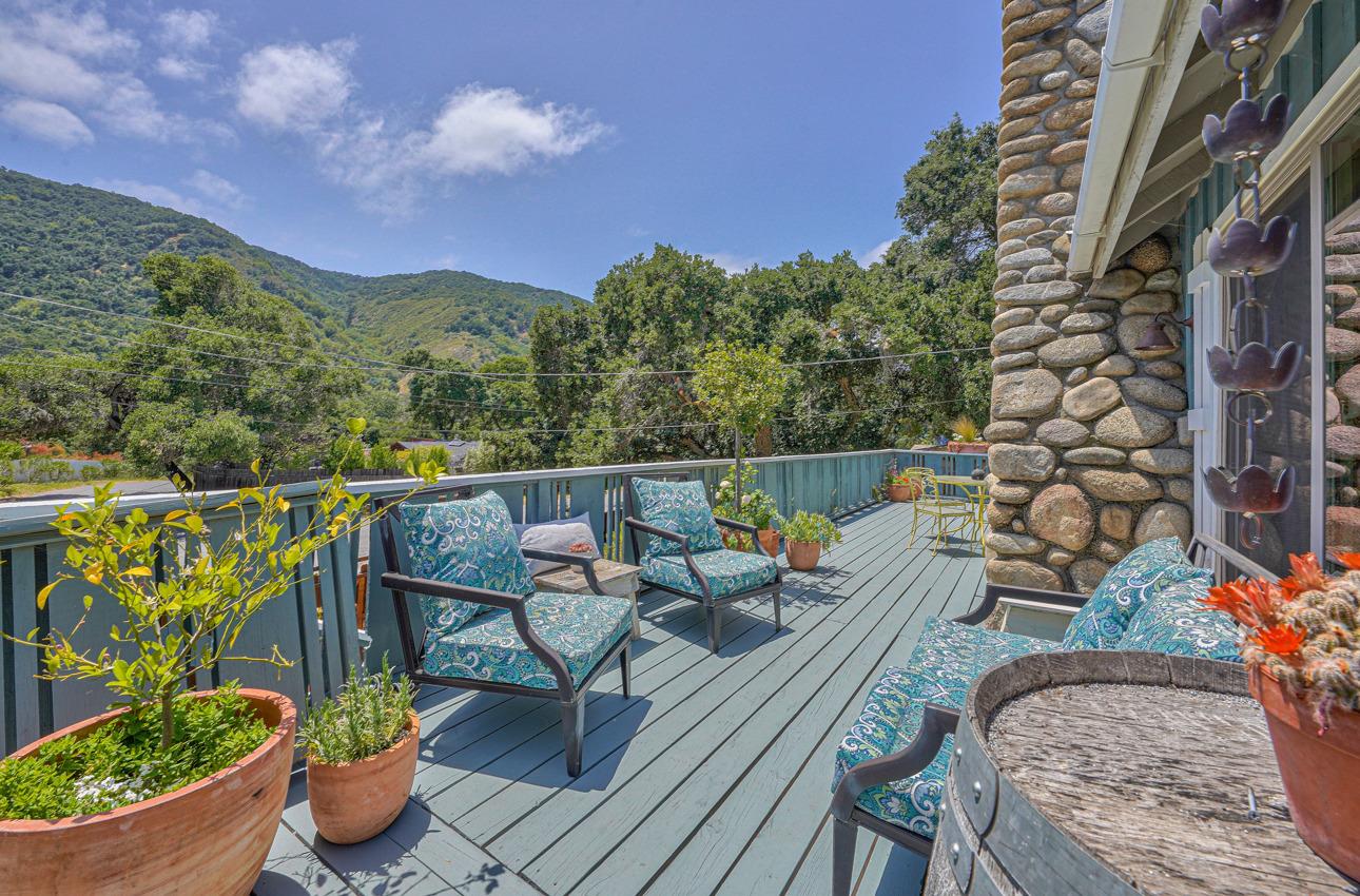 7 Paso Cresta Carmel Valley, CA 93924 - Photo 8 of 44 a balcony with wooden floor and potted plants