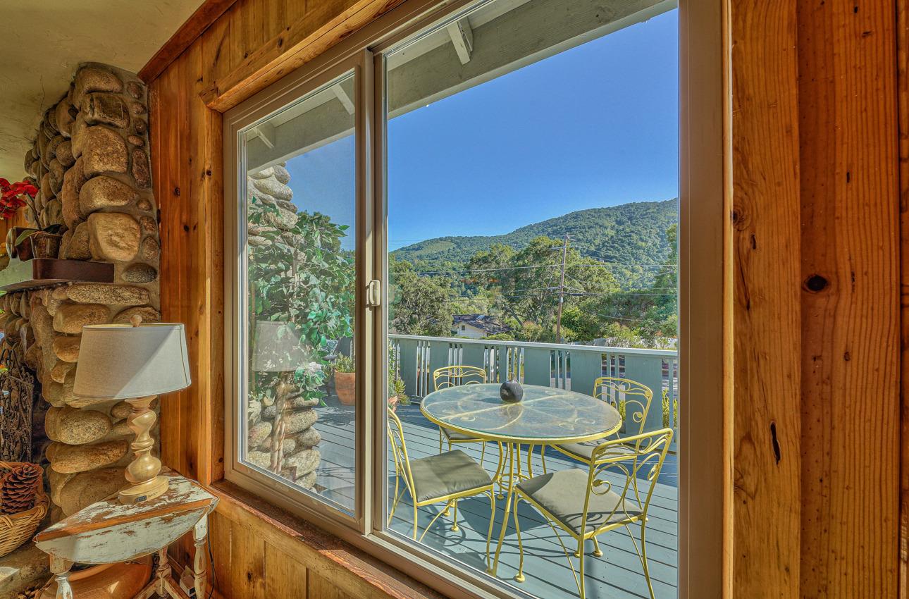 7 Paso Cresta Carmel Valley, CA 93924 - Photo 10 of 44 a view of a balcony with a table and chairs