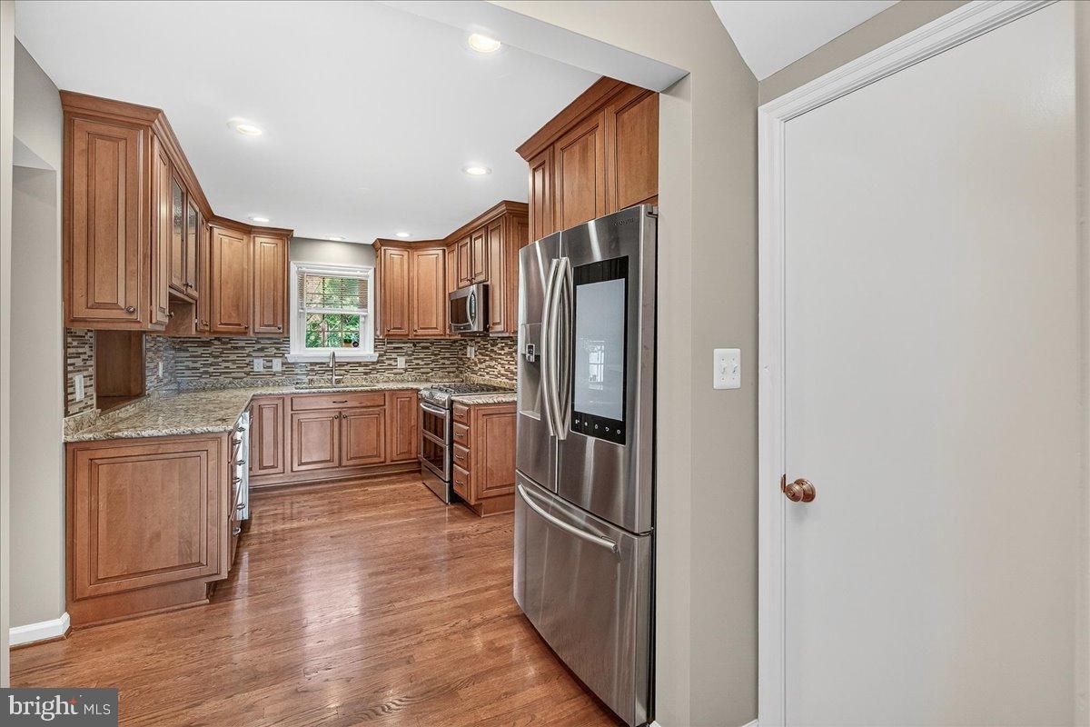 601 Culler Avenue Frederick, MD 21701 - Photo 24 of 146 Modern kitchen with rich wood cabinetry.