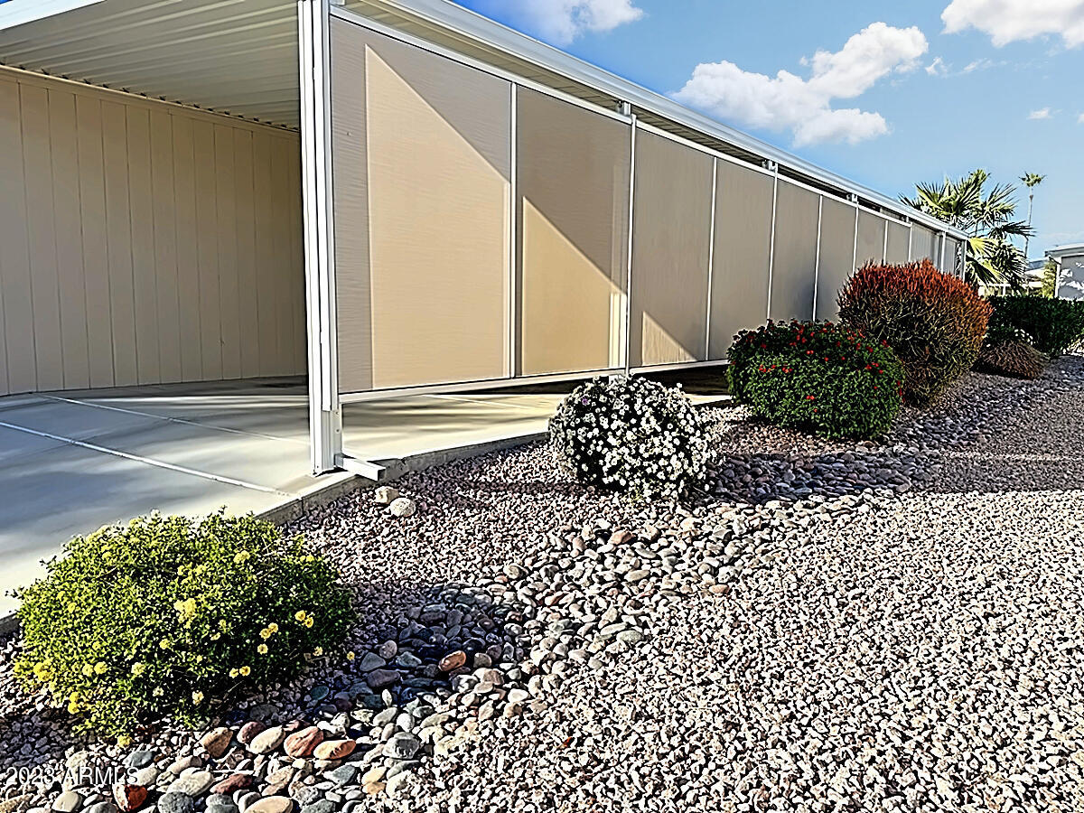 652 South Ellsworth Road, Unit 148 Mesa, AZ 85208 - Photo 32 of 33 PG148 CARPORT SCREENS AND LANDSCAPE