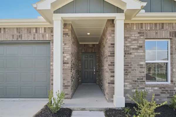 a front view of a house with a entryway