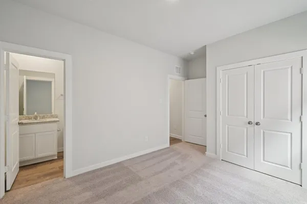 a view of cabinets and wooden floor