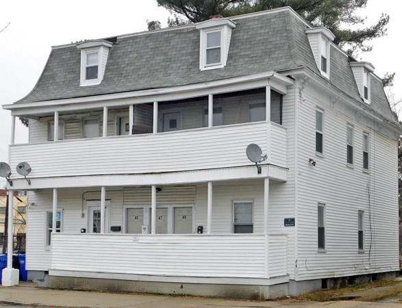 43-49 Oak Street Springfield, MA 01109 - Photo 1 of 8 a view of a white house with large windows