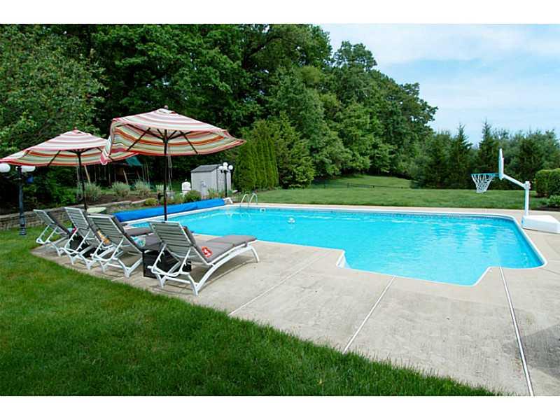 1837 Liberty Way Valencia, PA 16059 - Photo 24 of 25 Swimming Pool/Hot Tub/Sauna. The backyard escape includes a sparkling 20x40 heated pool surrounded by verdant landscape.