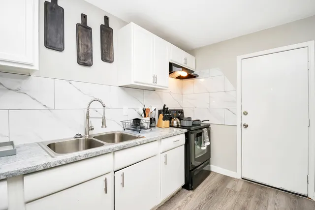 a kitchen with appliances and cabinets