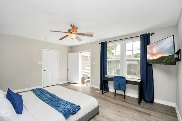 a bedroom with a bed and a chandelier