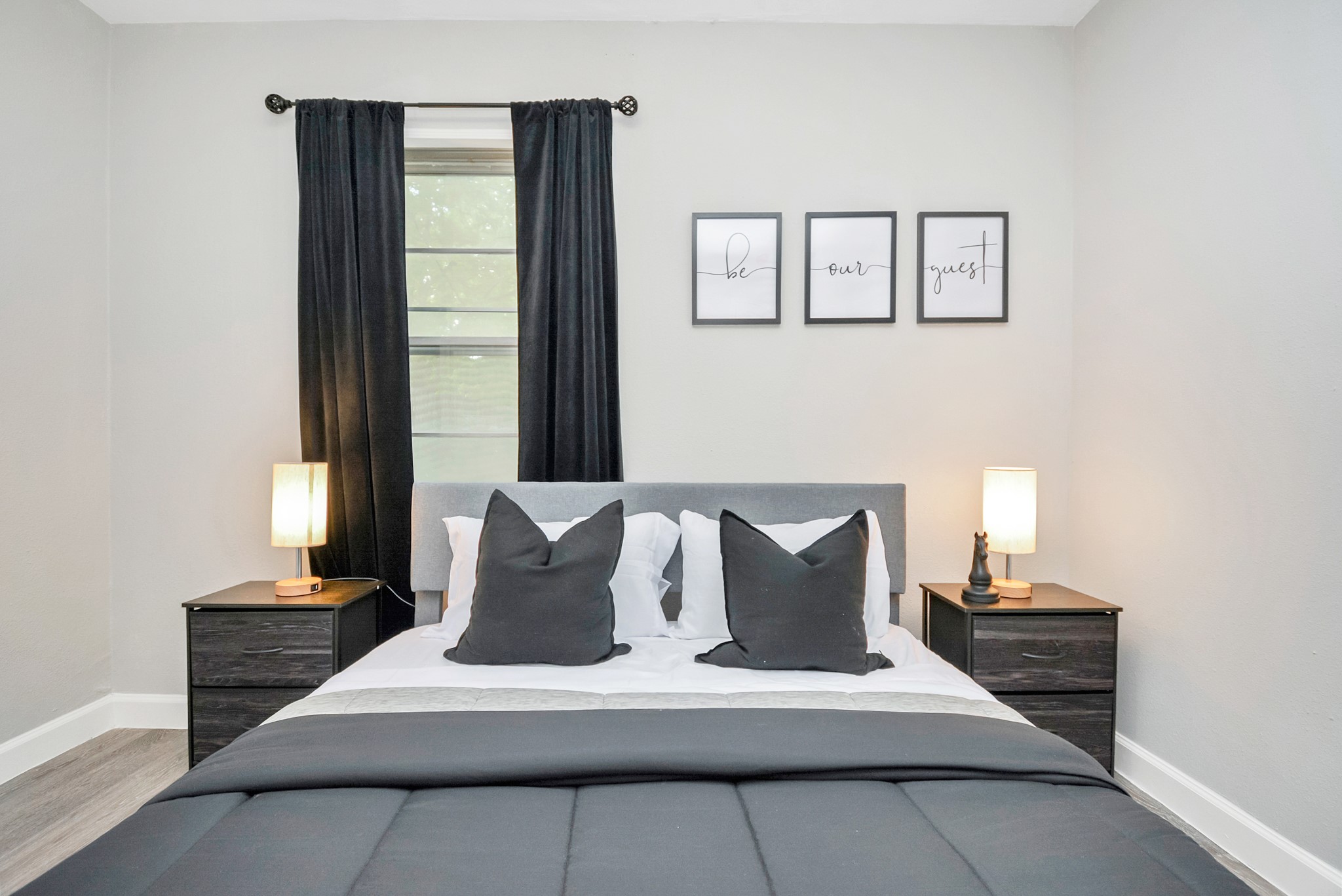 4710 Paradise Lane Houston, TX 77048 - Photo 23 of 42 a large white bed sitting in a living room next to a window